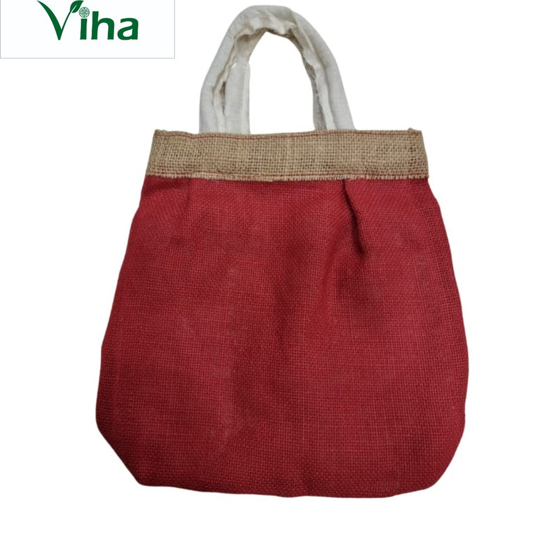 Jute bag with zip, a red textured fabric tote bag featuring two white fabric handles and a brown woven band across the top rim