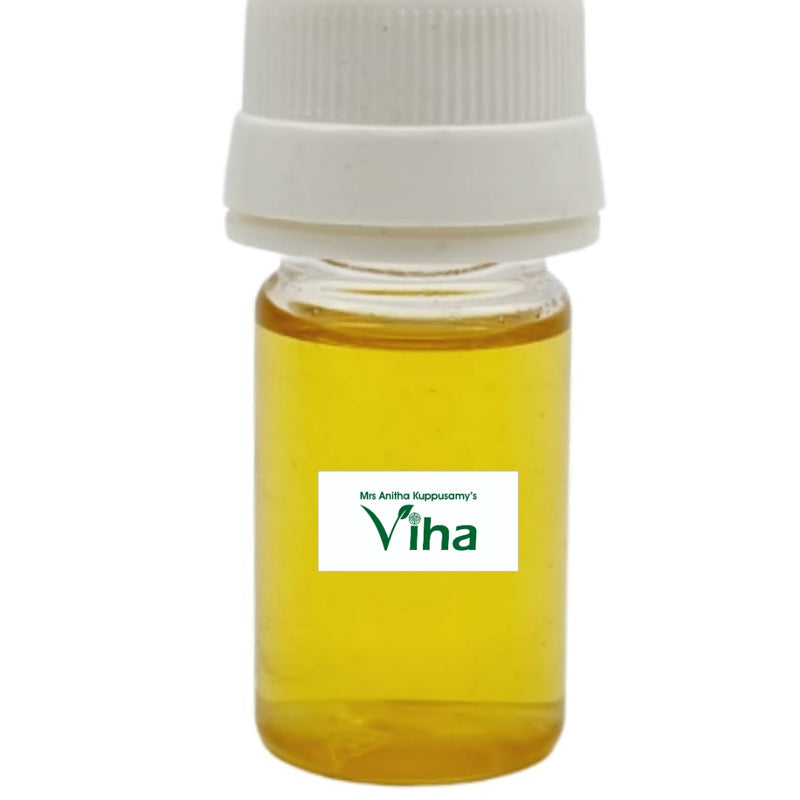 Saffron Oil, a small transparent glass bottle filled with yellow liquid, capped with a ridged white lid, features a rectangular label with green text