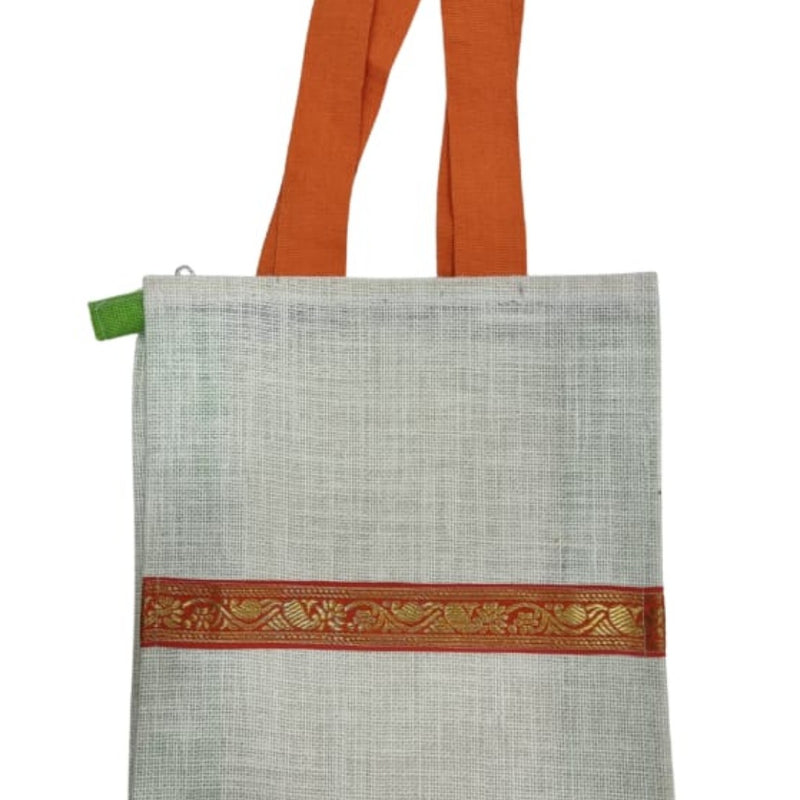 Jute Bag with Zip, an off-white textured fabric bag featuring two orange handles and a horizontal red and gold-toned patterned border across the front