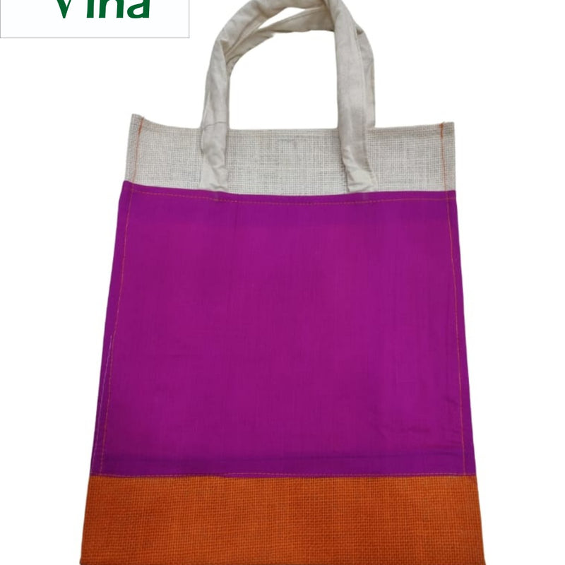 Jute Bag With Silk Design & With Zip, a vertical rectangular tote bag featuring white handles, a white textured top band, a magenta center, and an orange base