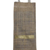 Jute Water Bottle Bag, a tall brown woven sack featuring one curved handle on top and a horizontal gold-toned band across the middle