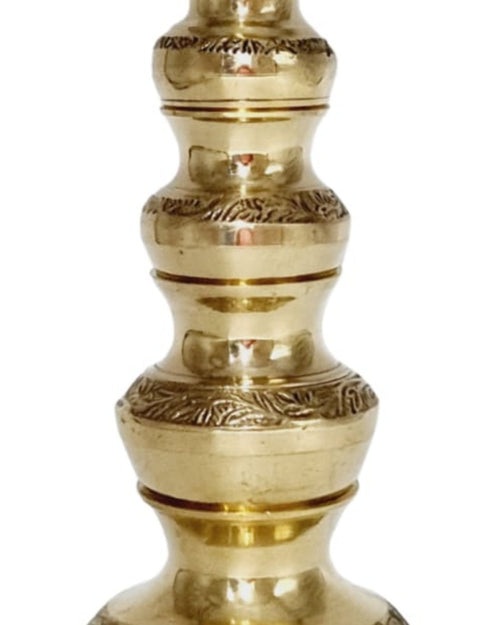 Lakshmi Kuberar lucky pot in brass, a tall stacked vessel of bulbous sections with engraved bands