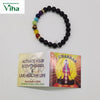 7 Chakra Bracelet Certified, a beaded bracelet with black, purple, blue, green, brown, yellow, and red textured spheres and two gold-toned spacers