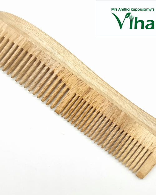 Neem Wood Comb, a light brown wooden-textured hair comb with thirty-four teeth set at an angle on a white background
