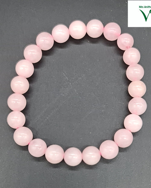 Rose Quartz Bracelet, pale pink round beads arranged in a circle