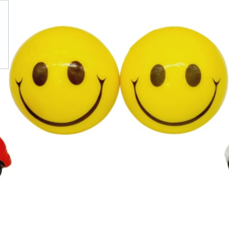 Smiley ball with Racing Car, two yellow smiley-face balls, one red toy car, and one white toy car