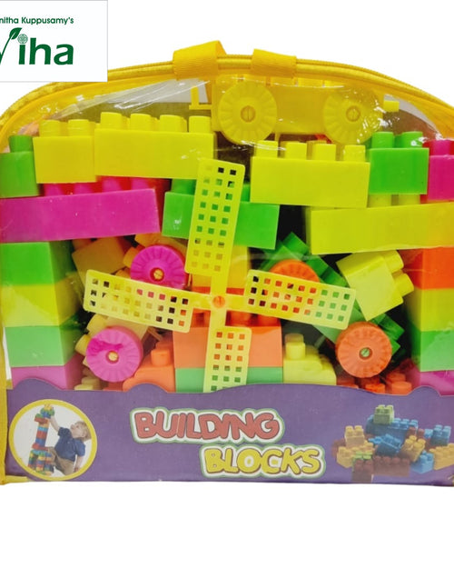 Building Blocks for Children, Kids, a yellow fabric and clear plastic bag filled with colorful plastic blocks and a four-bladed windmill