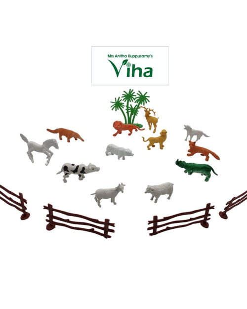 Animal Toys Children Game, twelve small multi-coloured plastic animal figurines and four brown fence pieces arranged around three green palm trees