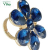 Fancy Designer Stone Ring, a gold-toned ring featuring six faceted dark blue stones arranged in a floral pattern