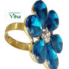 Fancy Designer Stone Ring, a gold-toned metal ring featuring a flower with six dark blue pear-shaped stones and a cluster of clear stones at the center