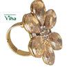 Fancy Designer Stone Ring, a gold-toned ring featuring a flower-shaped cluster set with six brownish pear-cut stones and tiny clear stones in the center