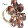 Fancy Designer Stone Ring, a gold-toned ring with a flower-shaped cluster of six faceted brown-pink stones surrounding a central round stone