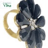 Fancy Designer Stone Ring, gold-toned ring featuring a flower-shaped cluster of eight black faceted petal stones surrounding clear center stones