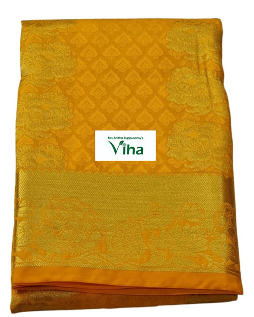 Silk Pavadai with running Blouse 8 to 16 years, yellow folded textile and large floral motifs