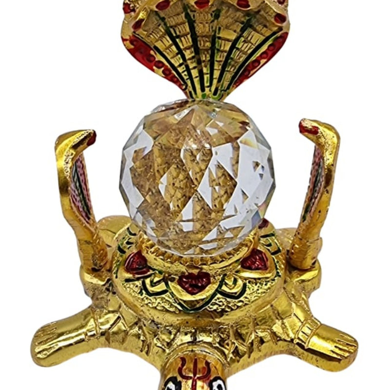 Five face Naag Kaala sharpa dosha nivaran yantra, a gold-toned turtle figurine with five cobra heads framing a faceted clear sphere on its back