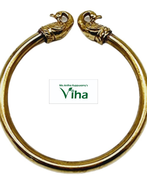 Peacock Face Bracelet (Kada), gold-toned open-ended bracelet with two opposing sculpted animal head terminals