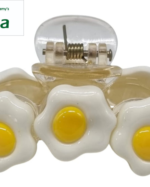 Strong Hair Clip in clear plastic topped with fried-egg shaped flower charms