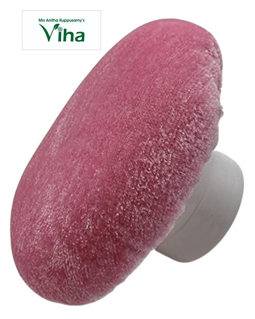Powder Puff, a pink fuzzy round applicator with a white handle