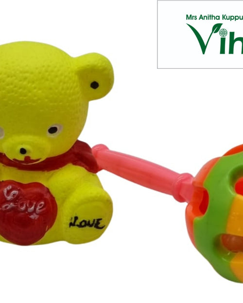 Teady bear toy with Kilukiluppai and a red heart on chest