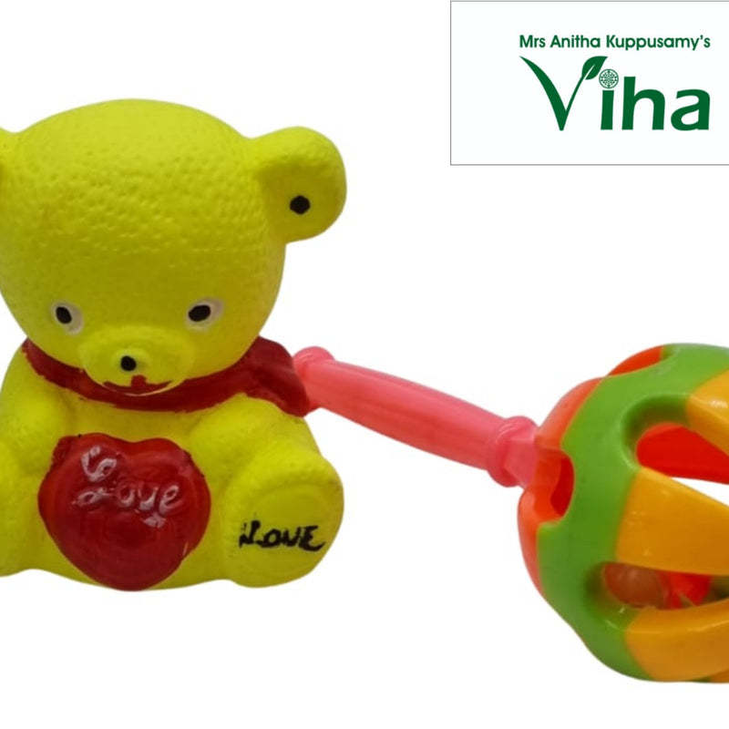 Teady bear toy with Kilukiluppai and a red heart on chest