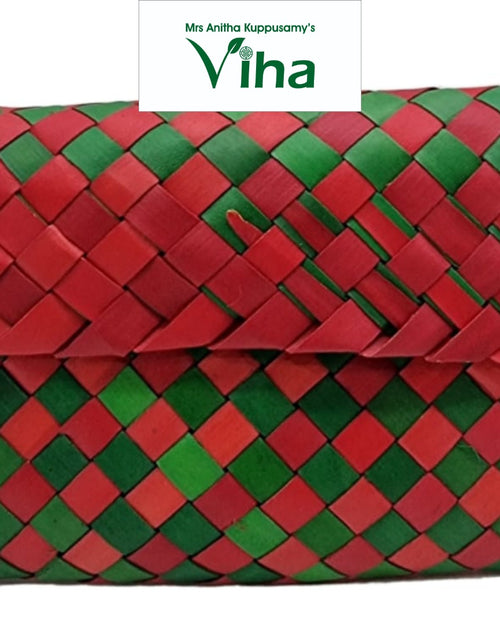 Palm Woven Pouch, a red and green woven rectangular envelope-style pouch featuring a diagonal plaid pattern across its entire surface