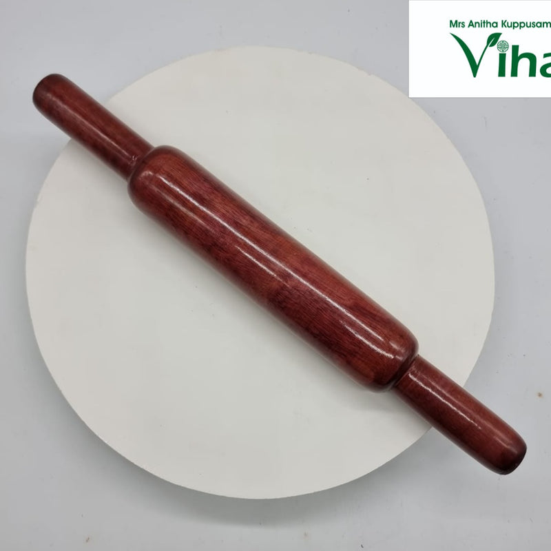 Wooden Chapati Poori Roller Set, a dark reddish-brown wooden rolling pin with a smooth, glossy surface resting diagonally on a white disc
