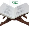 Wooden Hand Carved Holy Book Stand Worked with Brass, an open book resting on a dark brown wooden X-shaped stand