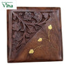 Wooden Box with Brass Flower Work, a square brown wooden object with carved flowers on one half and gold-toned inlaid leaves on the other