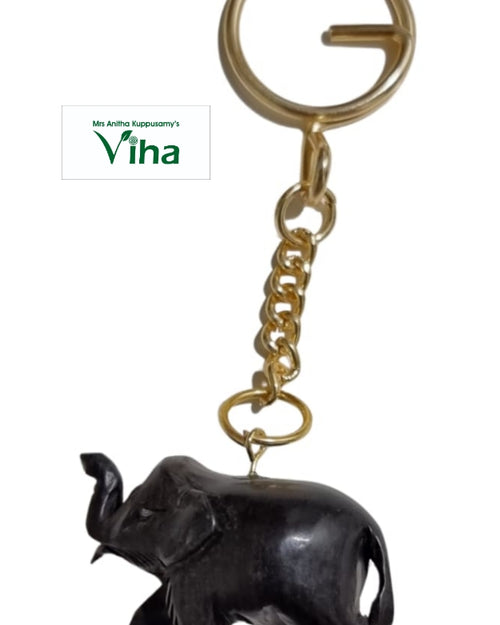 Karungali Elephant Keychain, a gold-toned metal keyring and six-link chain attached to a dark, polished elephant charm