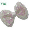 Designer Hair Clip, a bow covered in iridescent white sequins