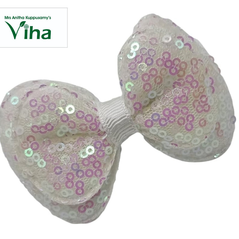 Designer Hair Clip, a bow covered in iridescent white sequins