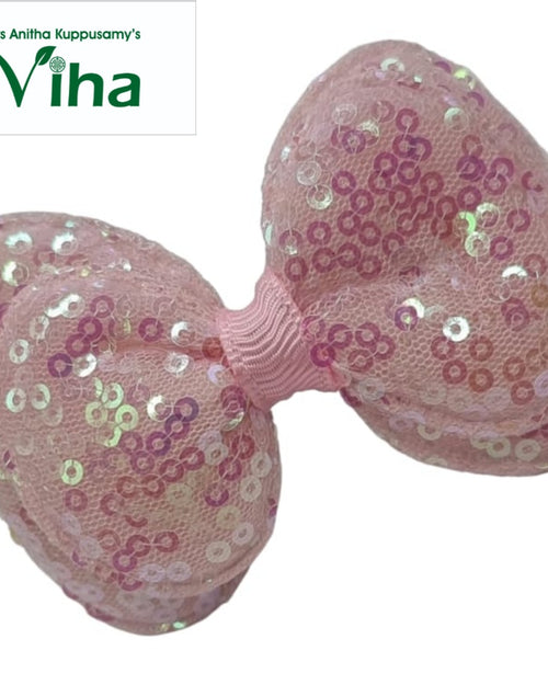 Designer Hair Clip, a pink bow featuring shiny pink and iridescent sequins over mesh fabric, centered with a ribbed band