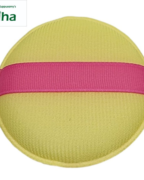 Powder Puff, a round, pale yellow-green textured pad featuring one horizontal pink ribbon strap across its middle