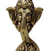 Laddu Ganesha in brass, crowned elephant head with the trunk curving down to a mound of laddus