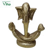 Ganesha in brass, stylised elephant head with wide flared ears and a long trunk over a crescent base