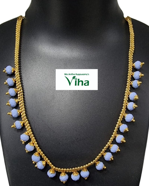 Impon Necklace with a multi-strand chain and faceted bead drops