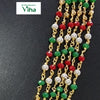 Aimpon Chain, five gold-toned wired strands featuring red, green, white, and golden beads on a black surface