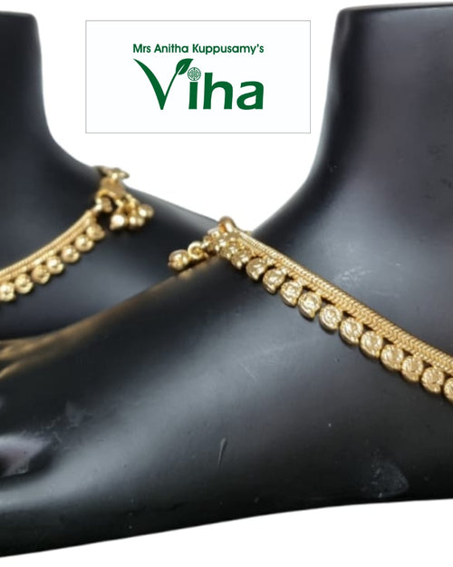Impon Anklets (Kolusu), gold-toned beaded anklets with small ball charms worn on mannequin feet