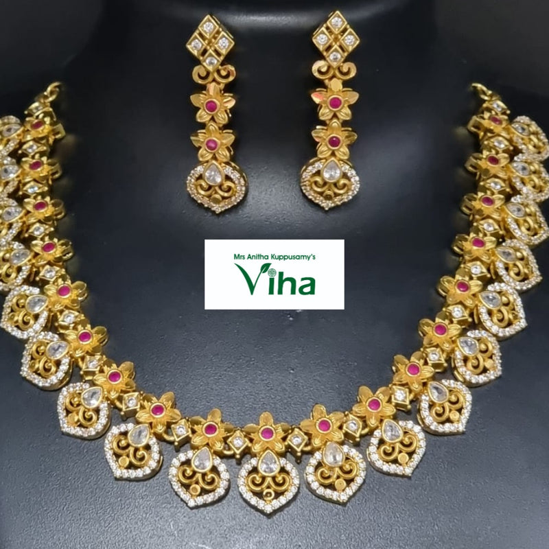 Impon Necklace Set with matching drop earrings and floral motifs