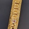 Impon Haram Set, a gold-toned chain features rectangular textured links and a flower motif with one red and six clear stones