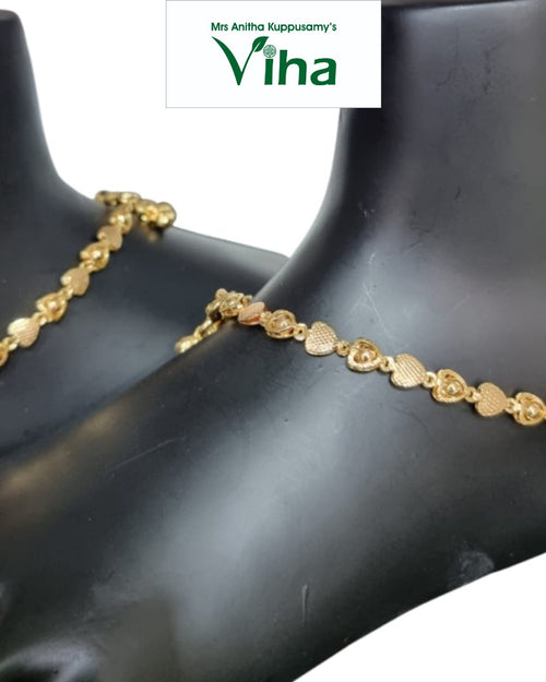 Impon Anklets,Payal, two gold-toned chains of textured hearts resting on black display forms