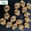 Impon Thali Kundu beads, gold-toned lantern-shaped beads piled on a dark background