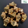 Impon Thali Kundu beads in gold-tone metal, faceted and piled on a dark background