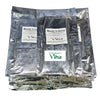 Woody Incense Sticks, a stack of shiny silver-toned metallic pouches with white rectangular printed labels on a white background
