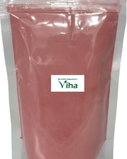 Tomato Powder, a vertical rectangular clear plastic pouch containing pink powder, featuring a central white label with green text and a leaf icon