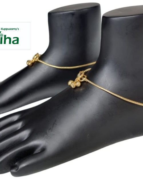 Impon Anklets, thin chains with small dangling charms, shown on black foot displays