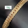 Impon Bracelet, a gold-toned flat herringbone chain with shiny links featuring diagonal grooved patterns spanning diagonally across a dark backdrop