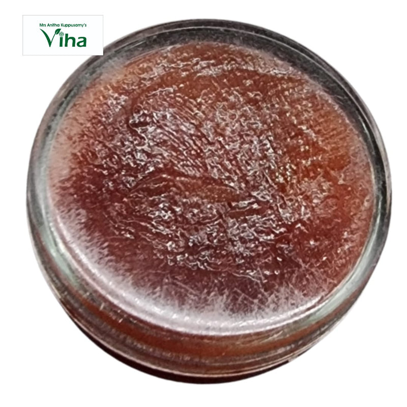 Javadhu Paste, a round transparent container filled with a glossy brown textured substance viewed from above
