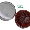 Javadhu Paste, two round jars, one with a translucent lid and one open containing a glossy brown paste
