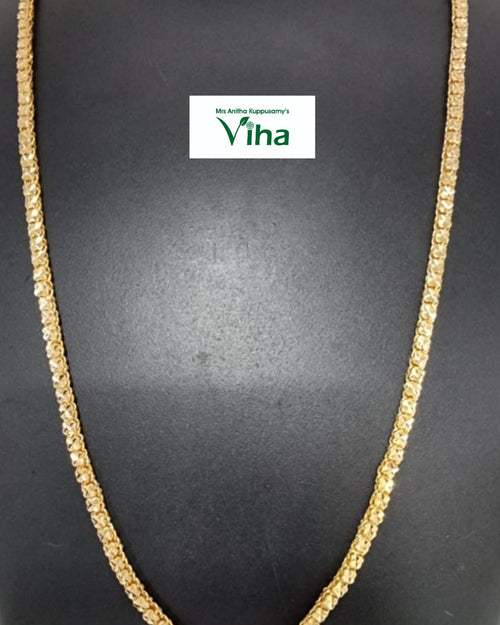 Aimpon Chain, a long, gold-toned chain necklace with densely packed, multifaceted, textured links displaying a reflective, sparkling surface finish